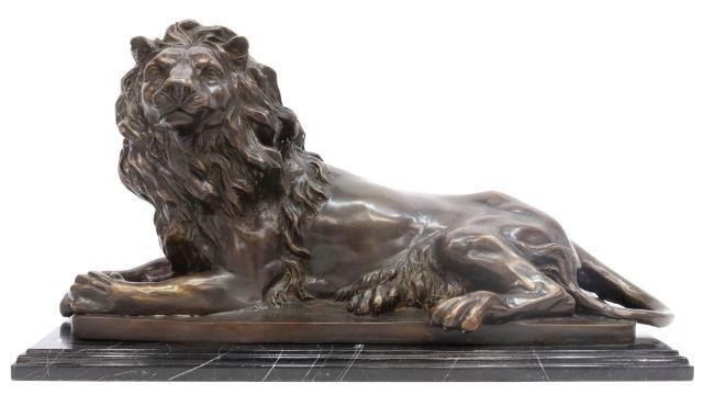 Appraisal: Patinated bronze sculpture of a recumbent lion on a stepped