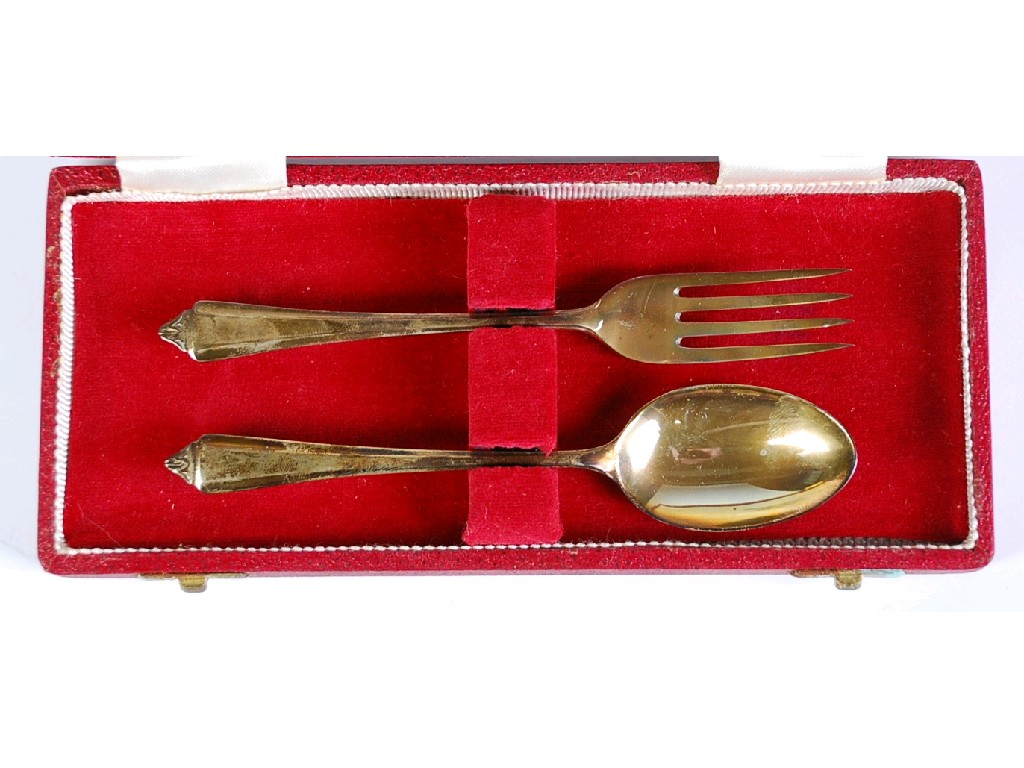 Appraisal: CHILD'S SILVER SPOON AND FORK with fan shaped handles in