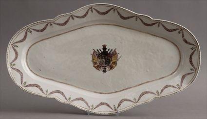 Appraisal: CHINESE EXPORT ARMORIAL PORCELAIN-STYLE PLATTER The oblong rim with leaf-tip