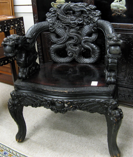 Appraisal: A PAIR OF CARVED DRAGON ARMCHAIRS Chinese early th century