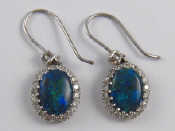 Appraisal: A pair of opal and diamond earrings opals approx x