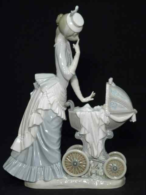 Appraisal: Lladro Spanish porcelain figurine titled ''Baby's Outing'' Marked on base