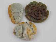 Appraisal: Three Chinese hardstone pendants being two mythical animals possibly kylin