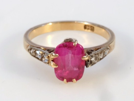 Appraisal: A dress ring the claw set central pink stone on