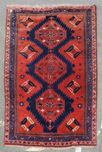 Appraisal: AN ANTIQUE CAUCASIAN KAZAK RUG decorated a stylised central triple