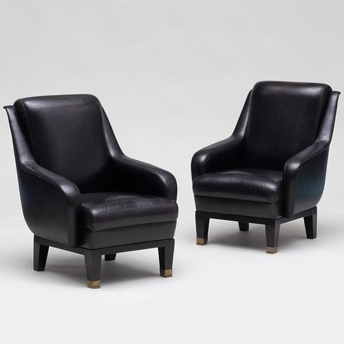 Appraisal: PAIR OF JACQUES QUINET STYLE BRASS-MOUNTED EBONIZED AND LEATHER ARMCHAIRS