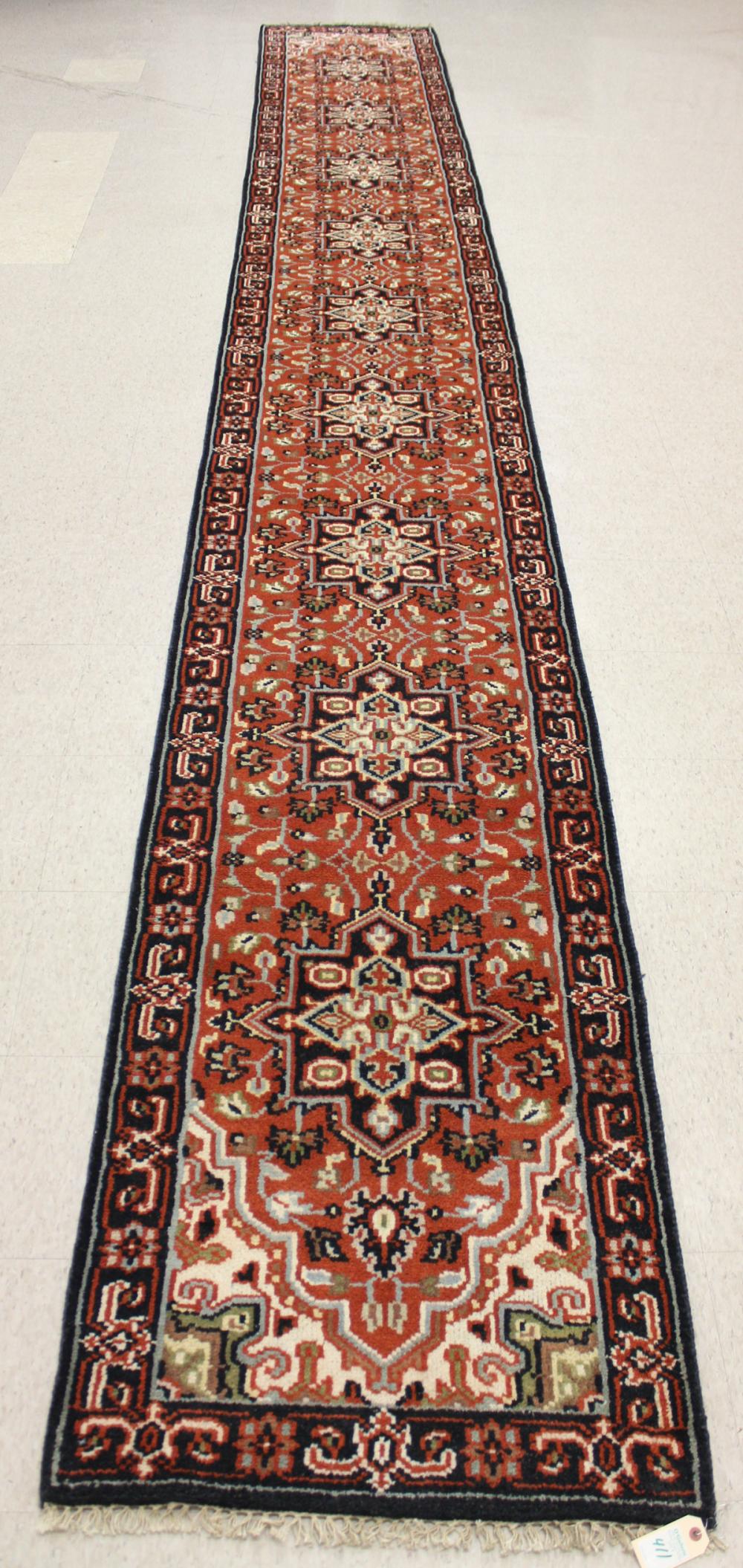 Appraisal: HAND KNOTTED ORIENTAL CORRIDOR RUG Indo-Persian featuring nine medallions and