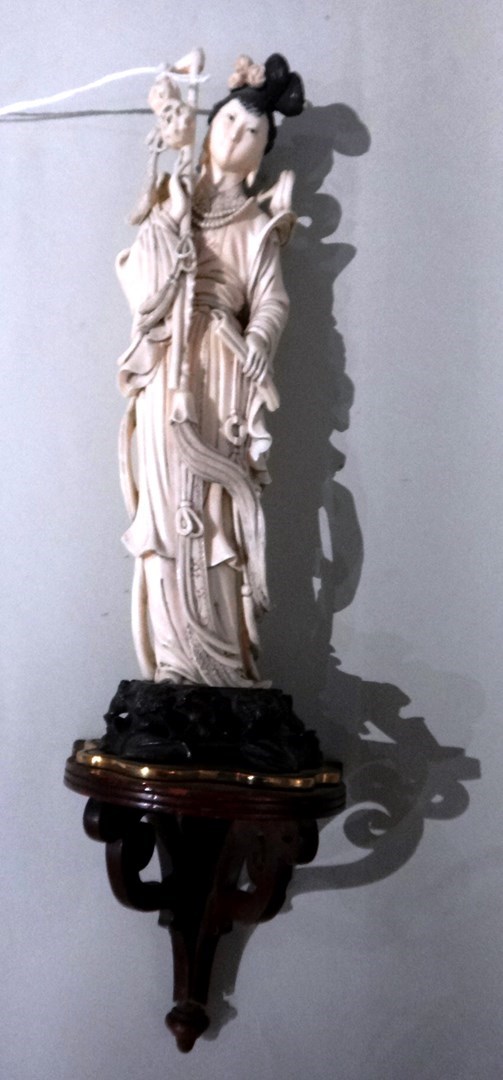 Appraisal: A Chinese ivory carving of a young woman th century