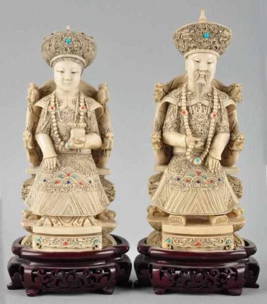 Appraisal: Pair of Ornate Solid Ivory FIgures Description Exquisite detail signed