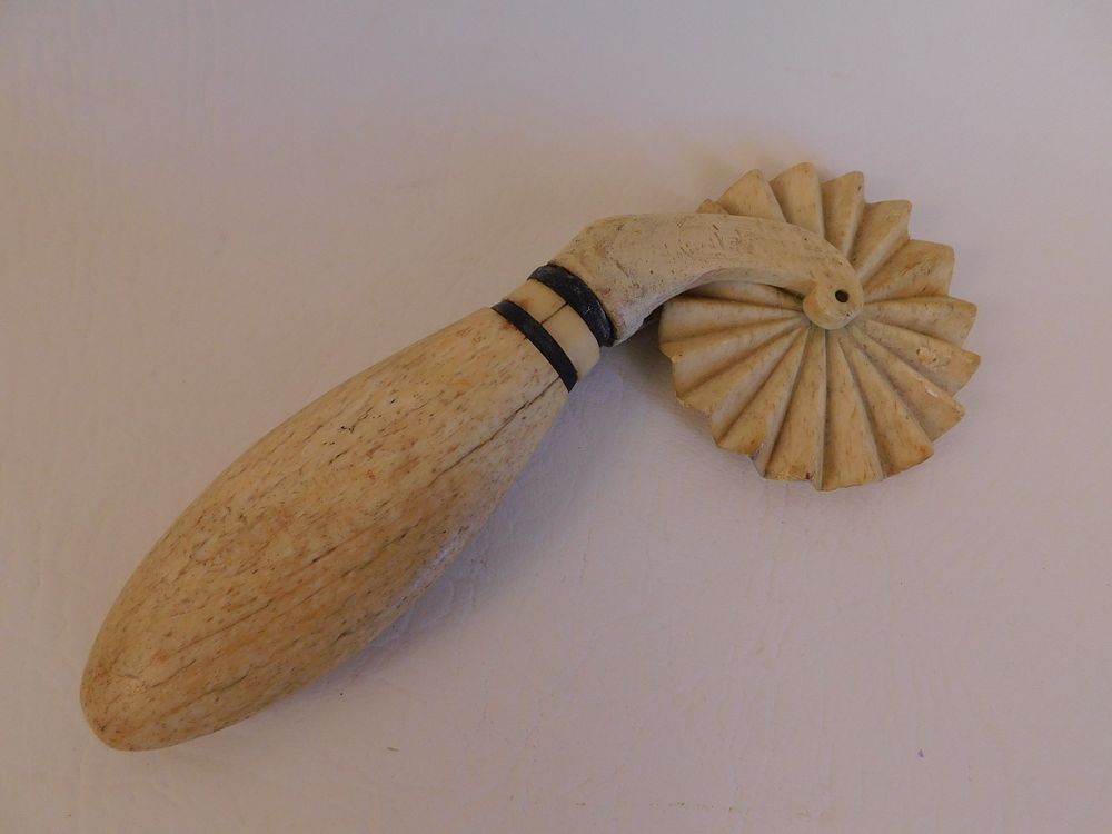 Appraisal: WHALE BONE CRIMPER th century carved sailor made whale bone