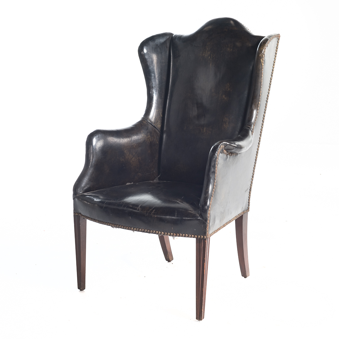 Appraisal: Federal style leather upholstered wing chair th century upholstered over