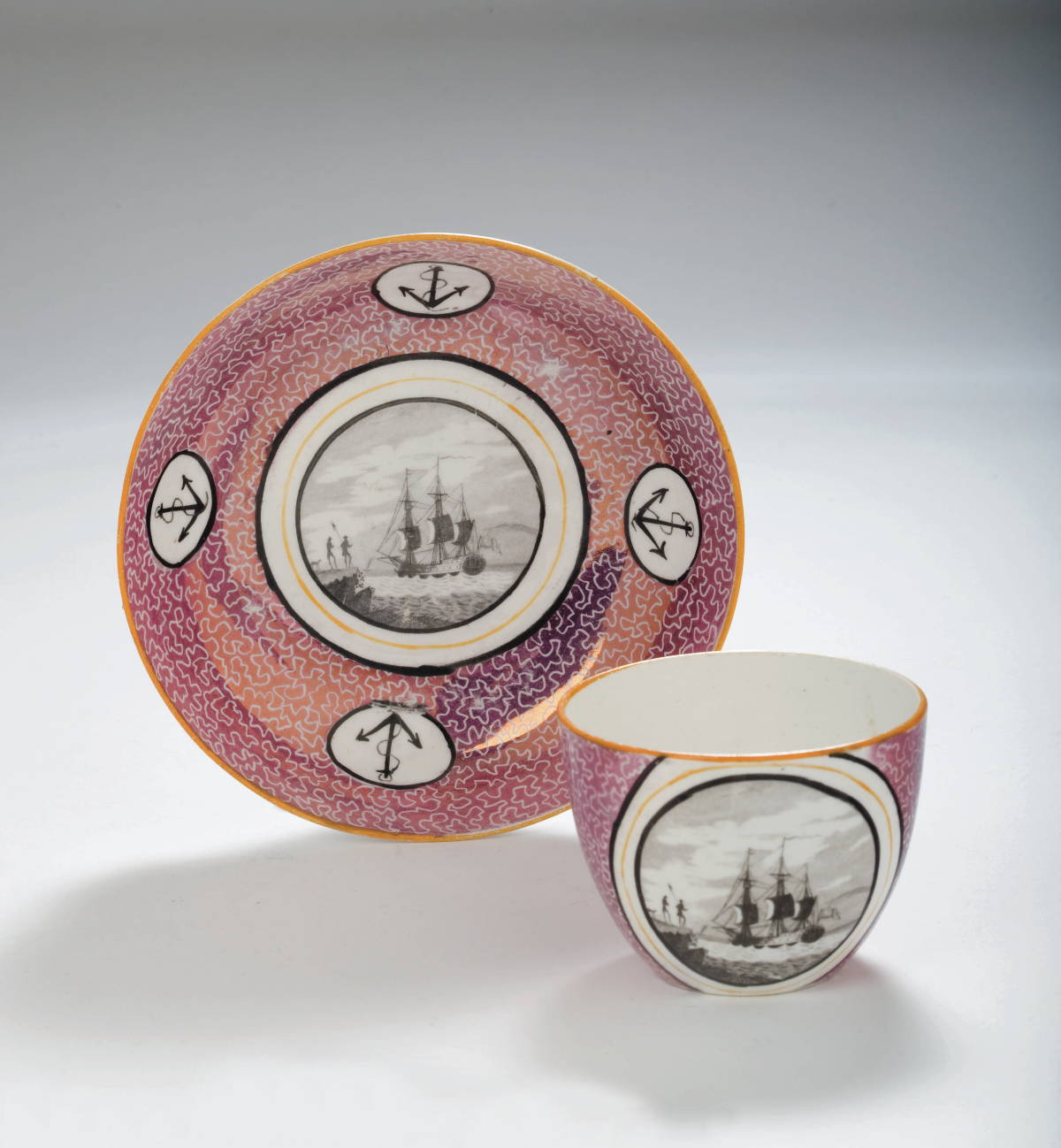 Appraisal: RARE BRITISH PINK LUSTRE ENAMEL-DECORATED AND BLACK TRANSFER-PRINTED CUP AND