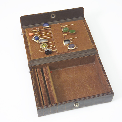 Appraisal: Eleven gold stickpins circa in a crocodile jewelry case The