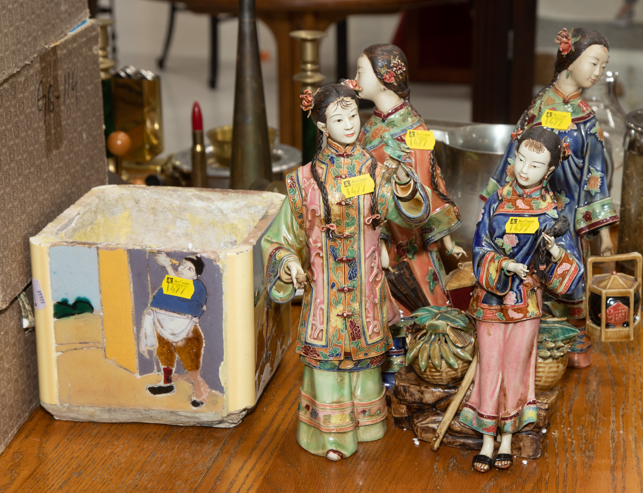 Appraisal: FOUR CHINESE STONEWARE FIGURES A PLANTER Comprising realistically modeled figures