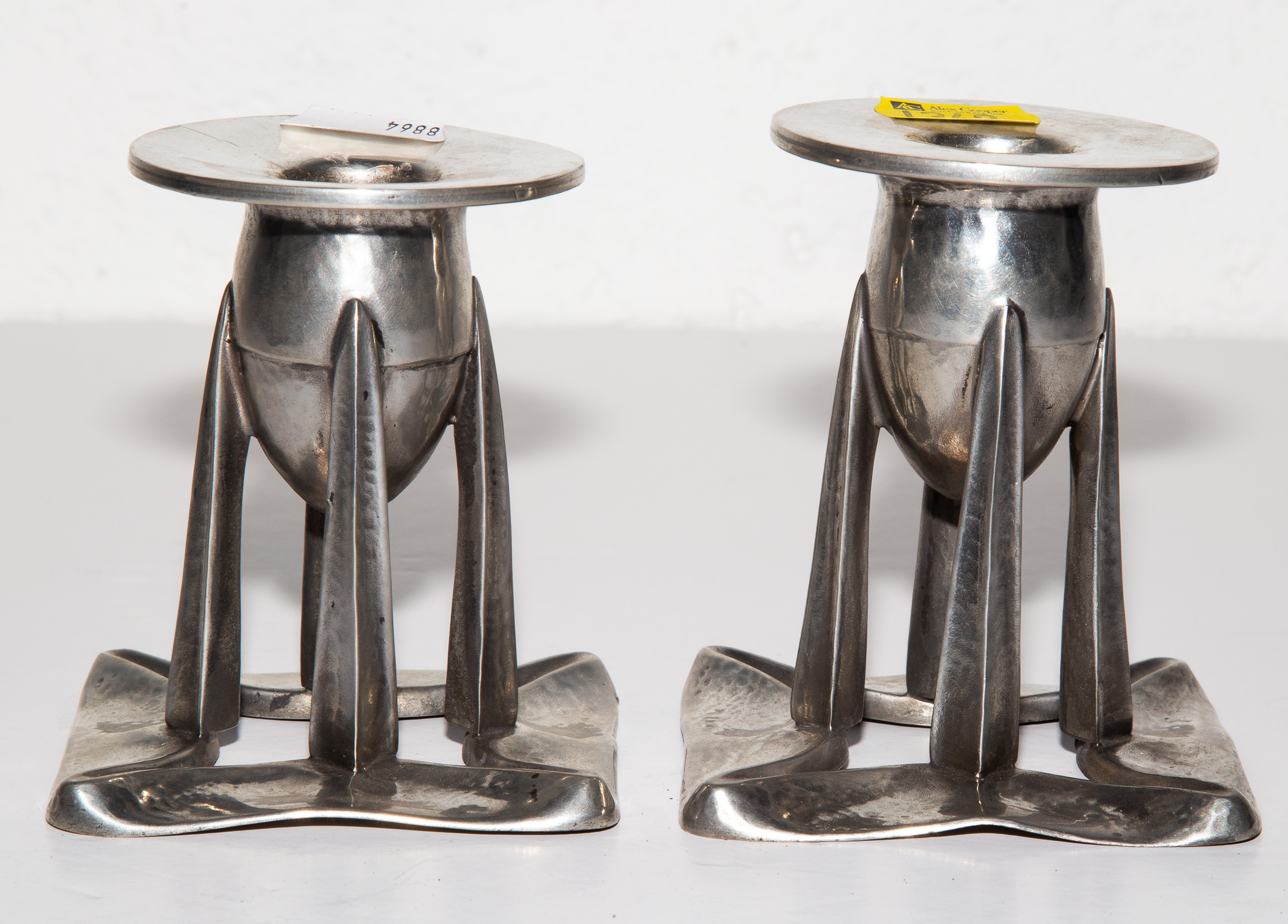 Appraisal: A PAIR OF ART NOUVEAU PEWTER CANDLESTICKS Liberty Co London