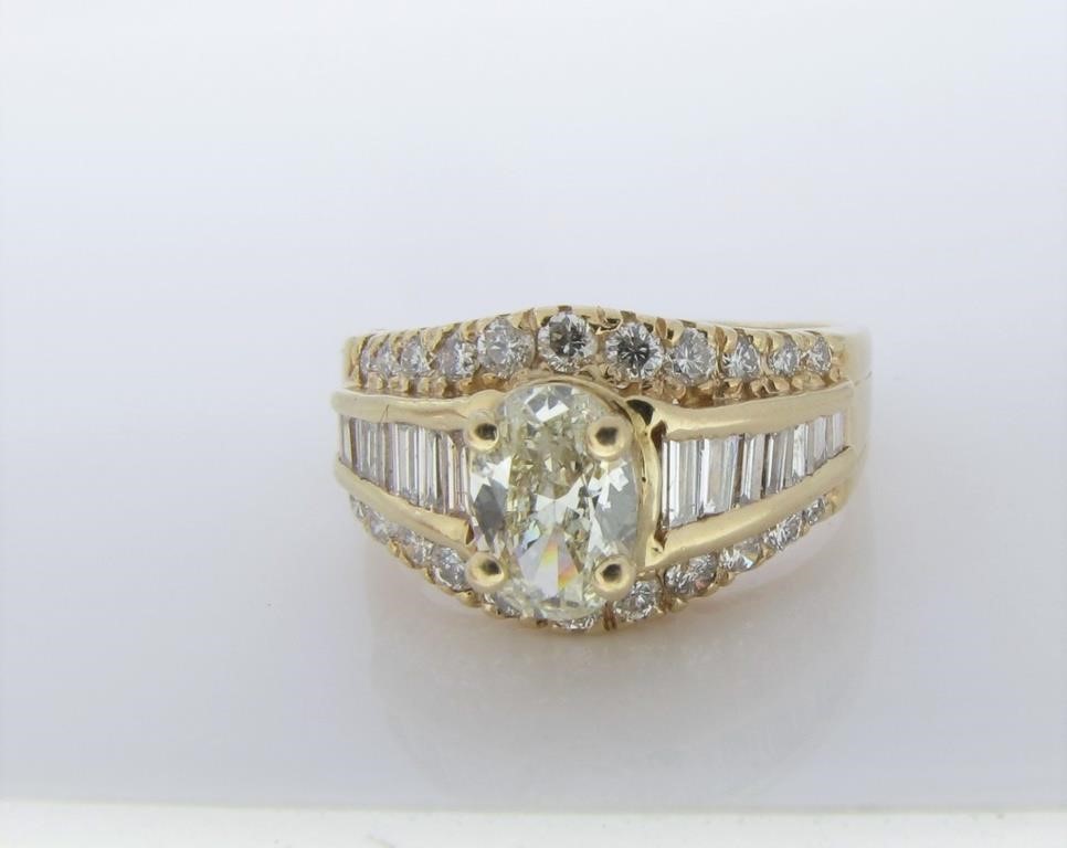 Appraisal: A K yellow gold featuring a ct center oval cut