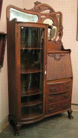 Appraisal: Vintage Golden Oak Curved Glass Bookcase Secretary with ornate carving