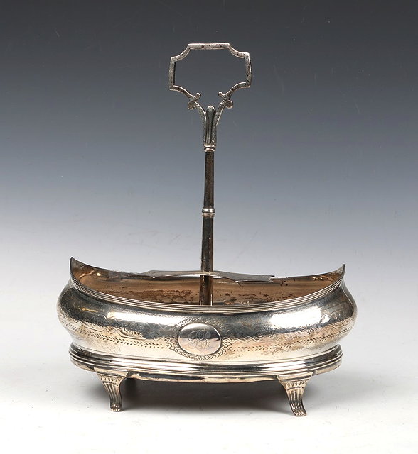 Appraisal: A GEORGIAN SILVER CRUET STAND oval shaped with engraved foliate