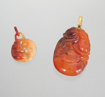 Appraisal: A Pair of Carved Agate Pendants Containing a carved agate