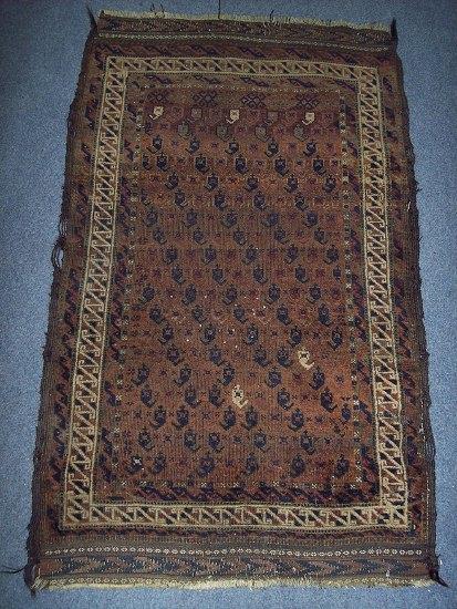 Appraisal: A Beluch rug of brown ground decorated diagonals of boteh