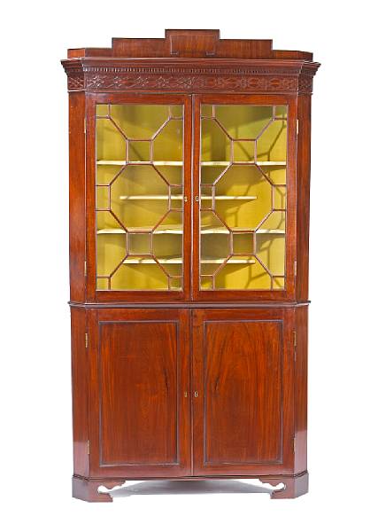 Appraisal: A George III mahogany corner cabinet late th century In