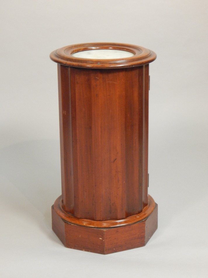 Appraisal: A Victorian walnut cylindrical pot cupboard the moulded top with