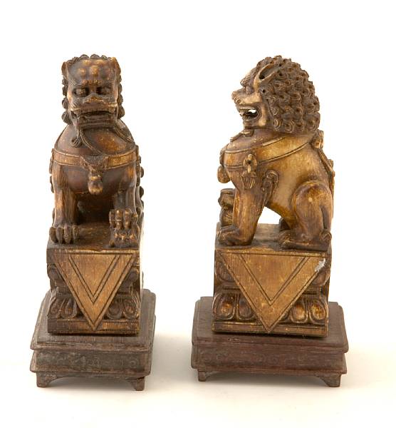 Appraisal: A pair of Chinese stained ivory Fu lions height in