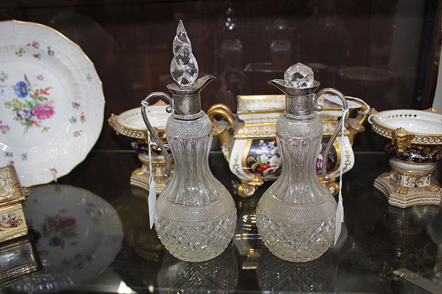 Appraisal: A PAIR OF SILVER MOUNTED HOBNAIL CUT GLASS WATER JUGS