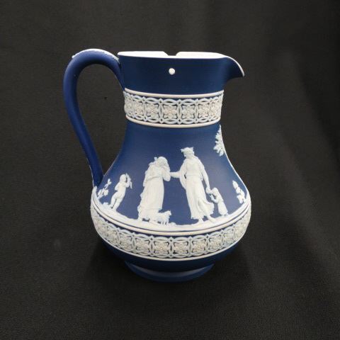 Appraisal: Wedgwood Dark Blue Jasperware Pitcher classical maidens and cupid