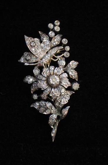 Appraisal: A DIAMOND-SET BROOCH in the form of a bouquet of