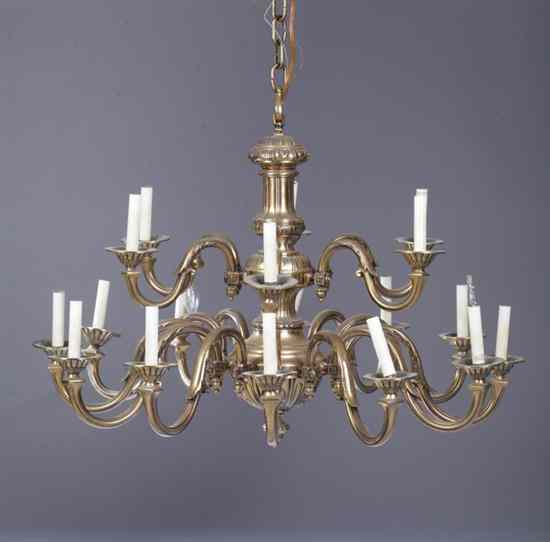 Appraisal: PAIR ENGLISH REGENCY STYLE BRASS -LIGHT TWO-TIER CHANDELIERS Six scrolling