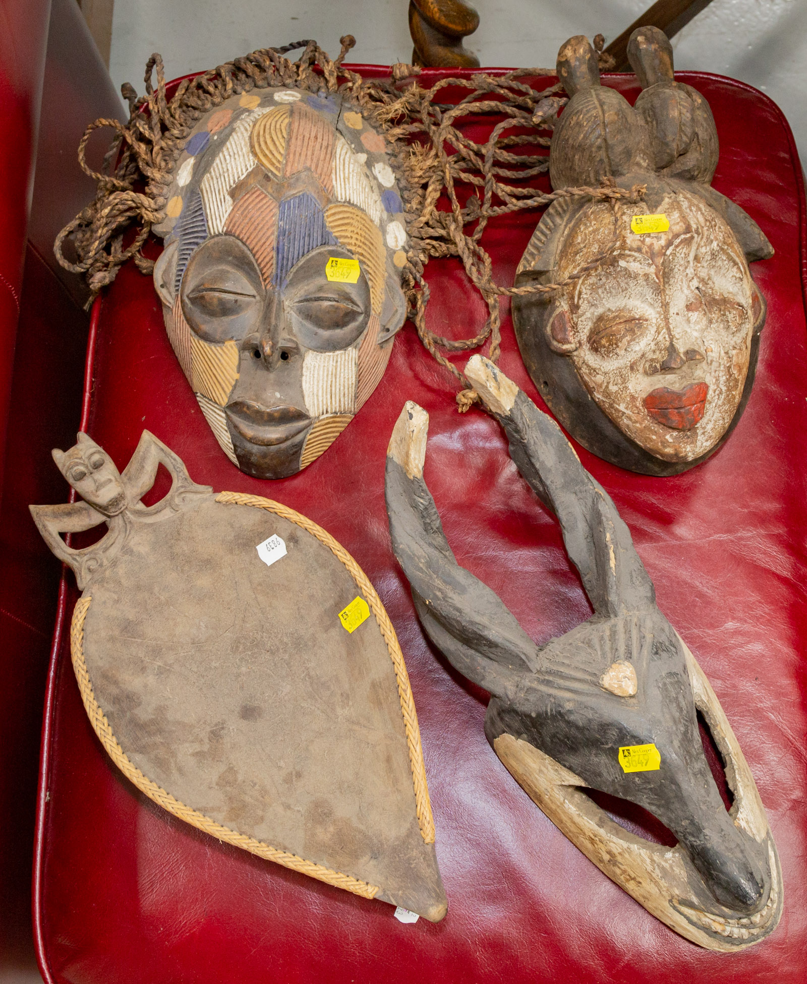 Appraisal: THREE AFRICAN CARVED WOOD MASKS A BOWL Later th century