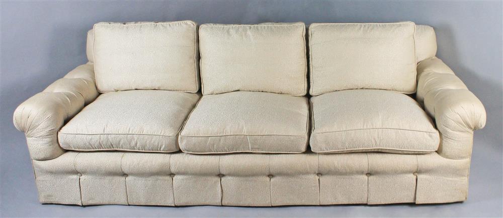 Appraisal: DESIGNER TONE-ON-TONE BEIGE SOFA WITH TUFTING ROLLED ARMS AND DOWN