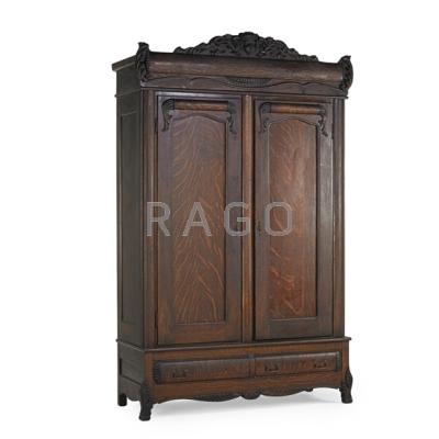 Appraisal: AMERICAN ARMOIRE Quartersawn oak with carved decoration two paneled doors