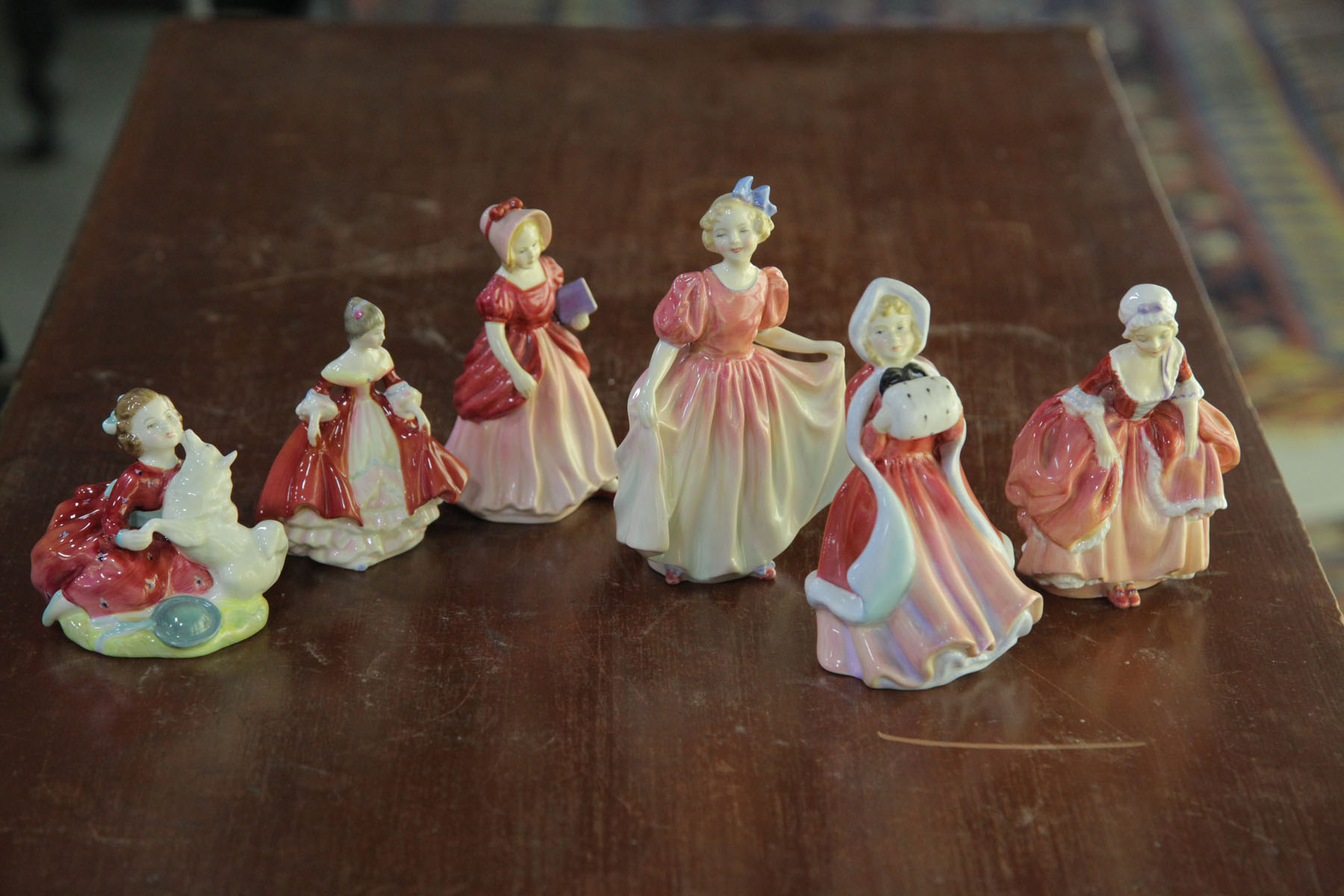 Appraisal: FOUR ROYAL DOULTON FIGURES AND TWO PARAGON FIGURES English th