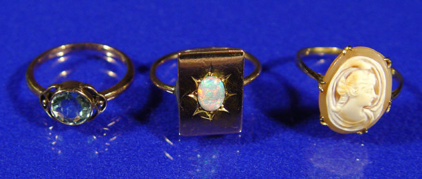 Appraisal: Gold and opal ring a gold and blue stone ring