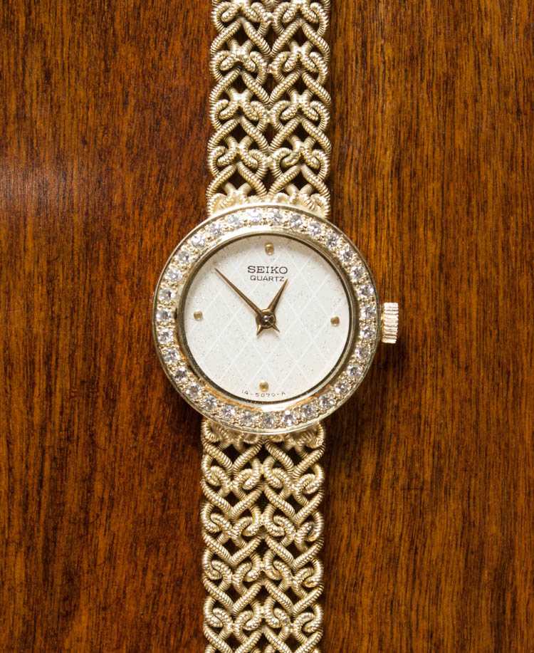 Appraisal: DIAMOND AND FOURTEEN KARAT GOLD WRIST WATCH Seiko quartz movement