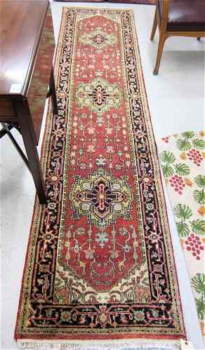 Appraisal: HAND KNOTTED ORIENTAL RUNNER Pakistani-Persian floral and multiple floral medallion