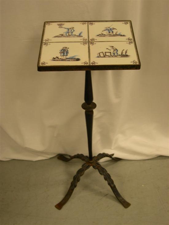 Appraisal: Iron base table with four French Faience tiles with figures