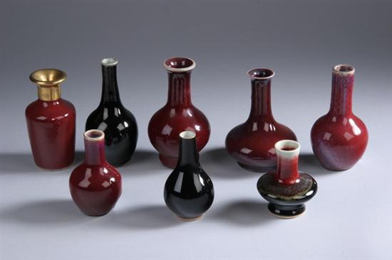 Appraisal: EIGHT CHINESE FLAMB COPPER RED AND MIRROR BLACK PORCELAIN VASES