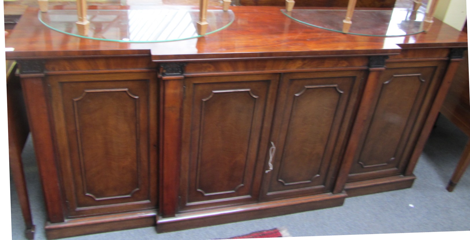 Appraisal: An early th century mahogany breakfront four door side cabinet