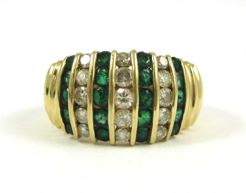 Appraisal: EMERALD DIAMOND AND FOURTEEN KARAT GOLD RING with four rows