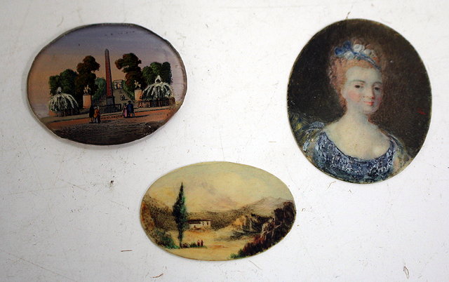 Appraisal: A SHOULDER LENGTH PORTRAIT MINIATURE OF A LADY WEARING BLUE