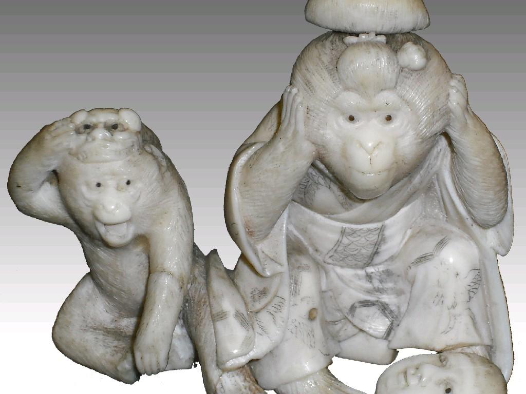 Appraisal: Japanese ivory netsuke of two monkeys one with a Noh