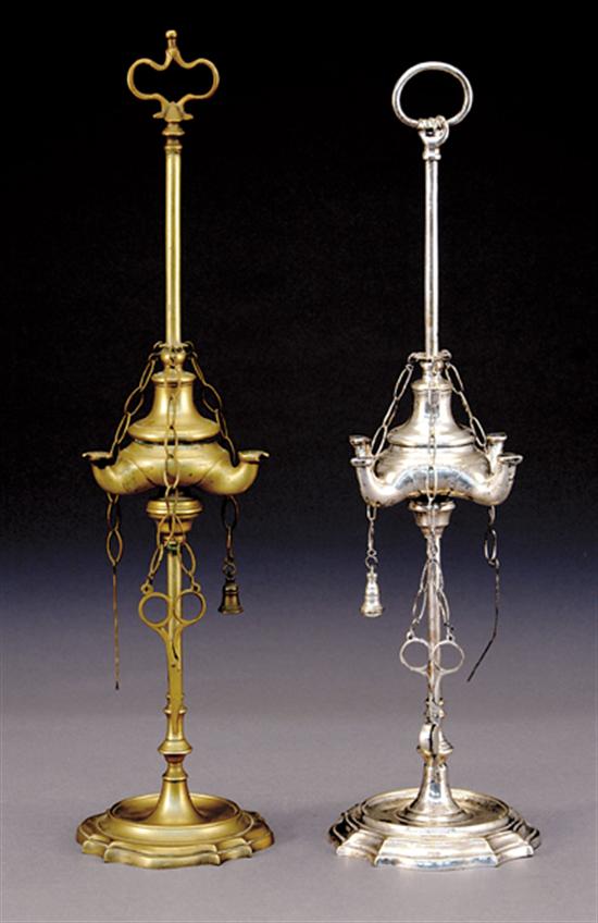 Appraisal: Two whale oil lamps th centuryfinial above traditional form on