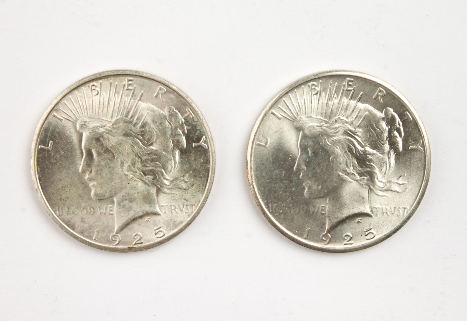 Appraisal: Two U S Peace type silver dollars comprising MS- and