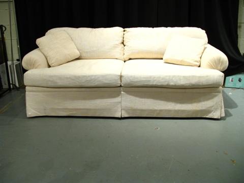 Appraisal: WHITE UPHOLSTERED SOFA WITH TWO PILLOWS TWO CUSHIONS