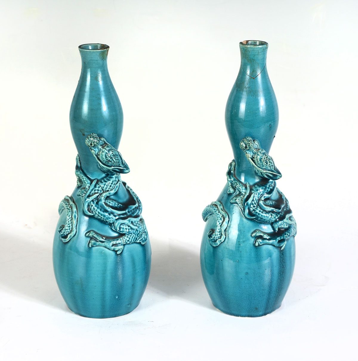 Appraisal: PAIR OF QING DYNASTY CHINESE DRAGON VASES Blue glazed Chinese