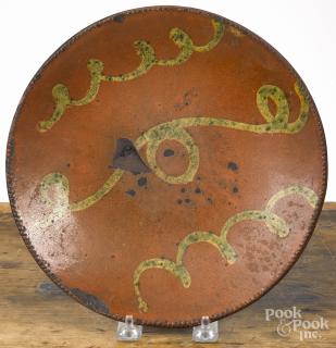 Appraisal: Redware plate th c with yellow and green slip decoration