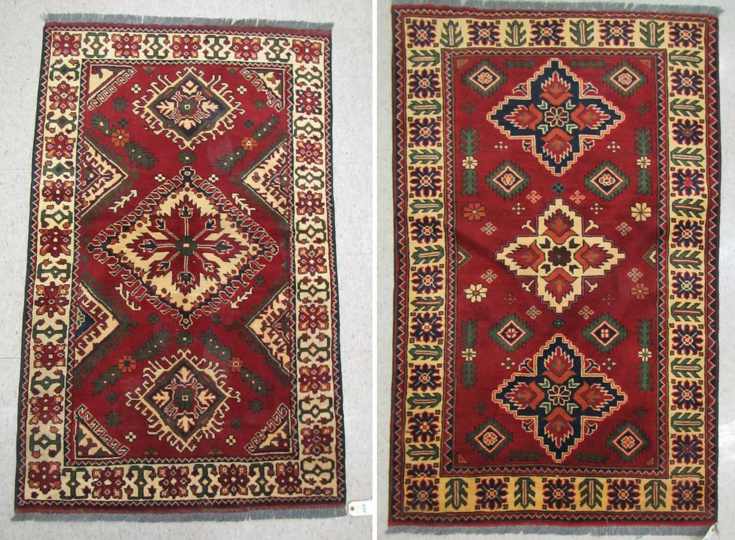 Appraisal: TWO SIMILAR HAND KNOTTED ORIENTAL AREA RUGS Pakistani Caucasians triple